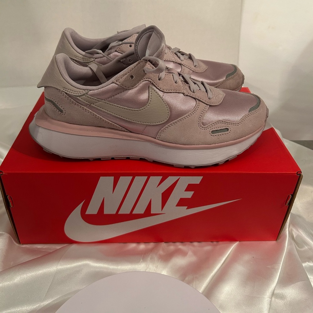 Nike plum chalk/platinum violet shoes.
